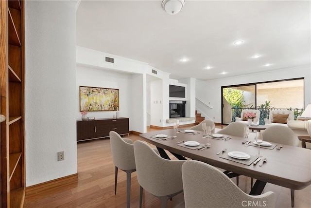 7137 Shoup Ave Unit 39, West Hills, CA 91307 - dining space featuring wood finished floors, stairs, and recessed lighting