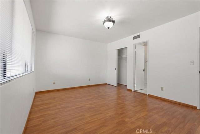 7137 Shoup Ave Unit 39, West Hills, CA 91307 - unfurnished bedroom with light wood-type flooring and baseboards