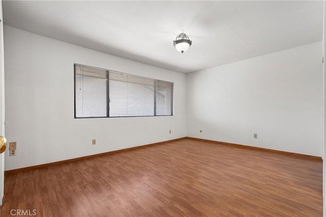 7137 Shoup Ave Unit 39, West Hills, CA 91307 - spare room with wood finished floors and baseboards