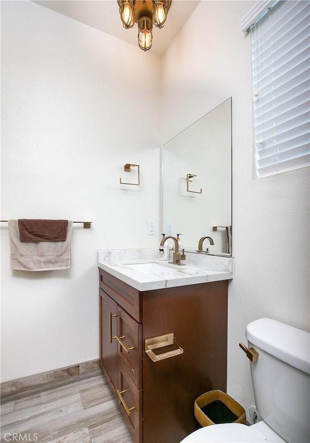19680 Griffith Dr, Saugus, CA 91350 - half bathroom featuring vanity and wood finished floors