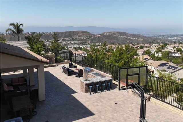 19680 Griffith Dr, Saugus, CA 91350 - view of patio featuring a mountain view and an outdoor kitchen
