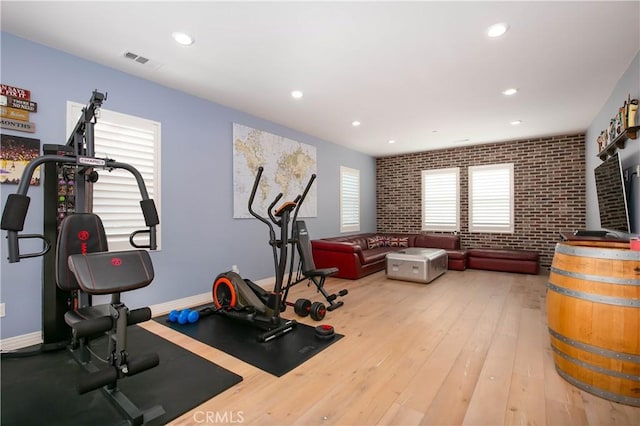 19680 Griffith Dr, Saugus, CA 91350 - workout area featuring recessed lighting, brick wall, and hardwood / wood-style flooring