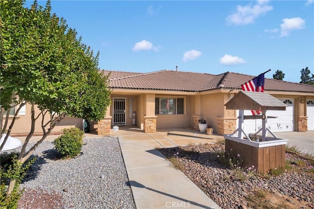 14908 Dakota Rd, Apple Valley, CA 92307 - view of front facade featuring a tile roof, stucco siding, and stone siding