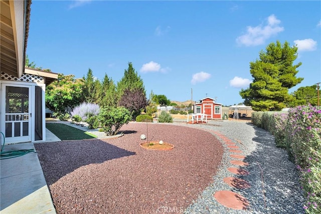14908 Dakota Rd, Apple Valley, CA 92307 - view of yard featuring a storage unit