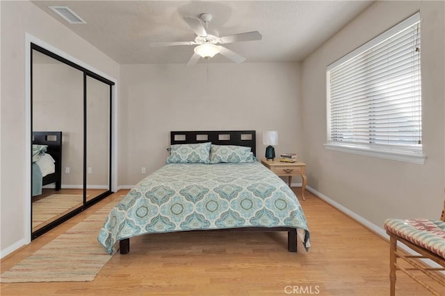 14908 Dakota Rd, Apple Valley, CA 92307 - bedroom with light wood-style floors, a closet, and a ceiling fan