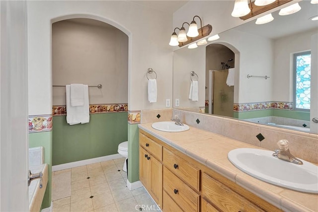 14908 Dakota Rd, Apple Valley, CA 92307 - bathroom with a stall shower, a bath, double vanity, and tile patterned flooring