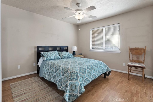 14908 Dakota Rd, Apple Valley, CA 92307 - bedroom with wood finished floors, ceiling fan, and a textured ceiling