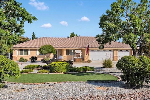 14908 Dakota Rd, Apple Valley, CA 92307 - single story home with a tiled roof, stucco siding, driveway, and a garage