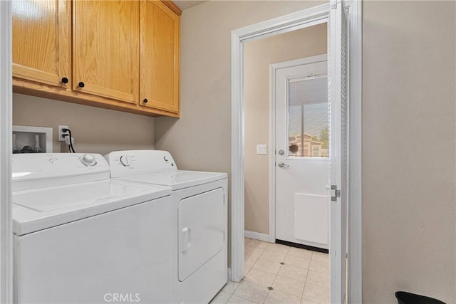 14908 Dakota Rd, Apple Valley, CA 92307 - laundry room with separate washer and dryer, cabinet space, and light tile patterned floors