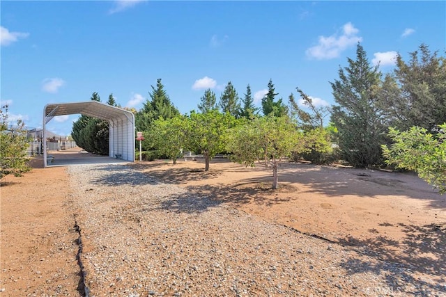 14908 Dakota Rd, Apple Valley, CA 92307 - view of yard featuring a detached carport and dirt driveway