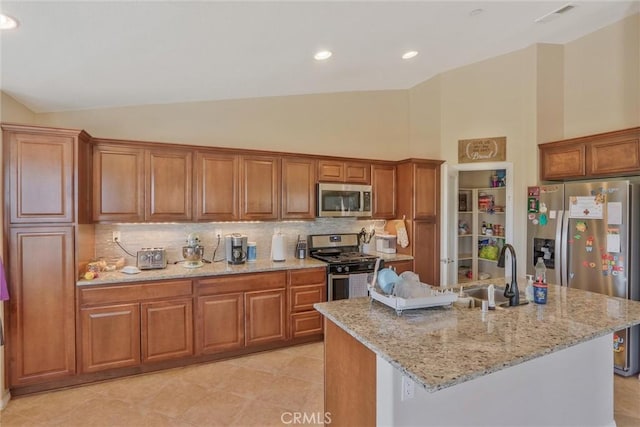 32124 Evening Primrose Trl, Campo, CA 91906 - kitchen with stainless steel appliances, brown cabinets, backsplash, high vaulted ceiling, and recessed lighting
