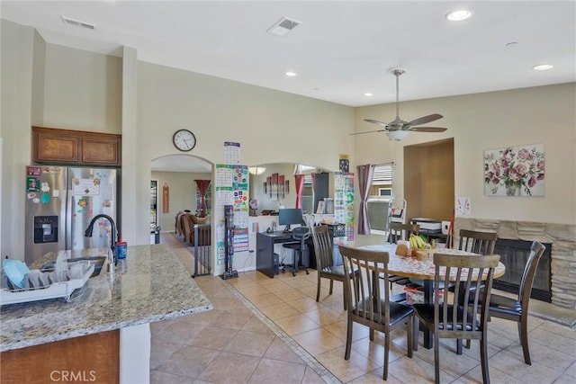 32124 Evening Primrose Trl, Campo, CA 91906 - dining room featuring light tile patterned flooring, recessed lighting, ceiling fan, a towering ceiling, and arched walkways