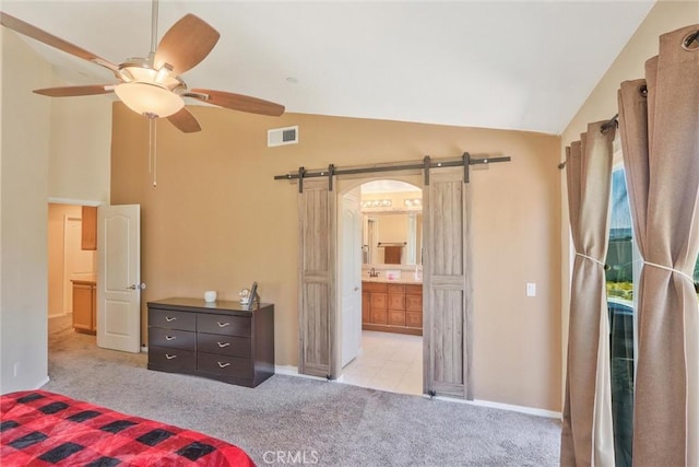 32124 Evening Primrose Trl, Campo, CA 91906 - bedroom with a barn door, carpet floors, high vaulted ceiling, ensuite bath, and ceiling fan