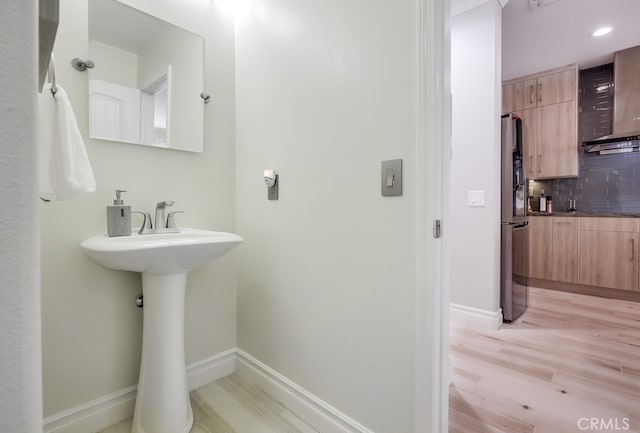 373 W Pebble Creek Ln, Orange, CA 92865 - bathroom with decorative backsplash and wood finished floors