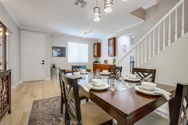 373 W Pebble Creek Ln, Orange, CA 92865 - dining room featuring light wood-style floors, stairway, and ornamental molding