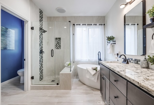 373 W Pebble Creek Ln, Orange, CA 92865 - bathroom featuring vanity, healthy amount of natural light, a freestanding tub, and a shower stall