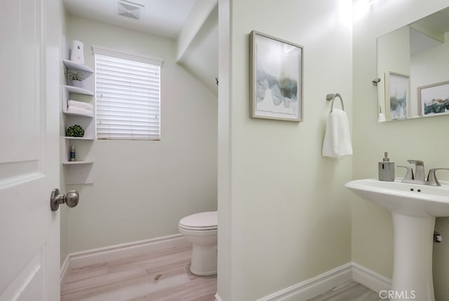 373 W Pebble Creek Ln, Orange, CA 92865 - half bath featuring toilet and wood finished floors