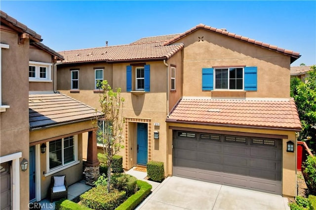 373 W Pebble Creek Ln, Orange, CA 92865 - view of front of home featuring a tile roof, concrete driveway, a garage, and stucco siding