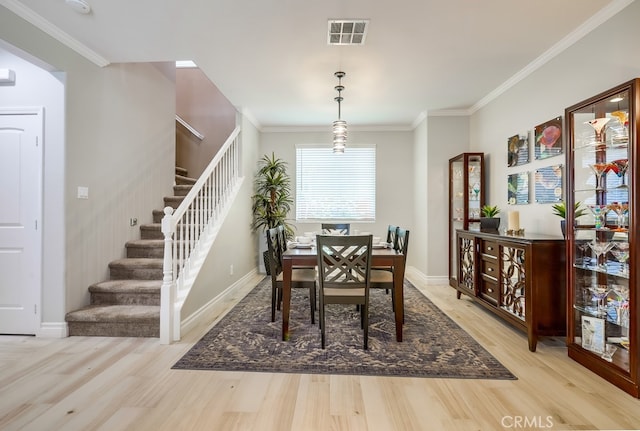 373 W Pebble Creek Ln, Orange, CA 92865 - dining room with stairway, light wood-style flooring, and ornamental molding