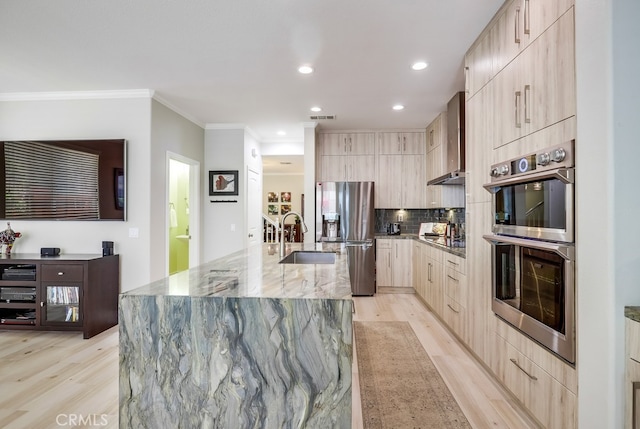 373 W Pebble Creek Ln, Orange, CA 92865 - kitchen with modern cabinets, light brown cabinetry, appliances with stainless steel finishes, light wood-style floors, and crown molding