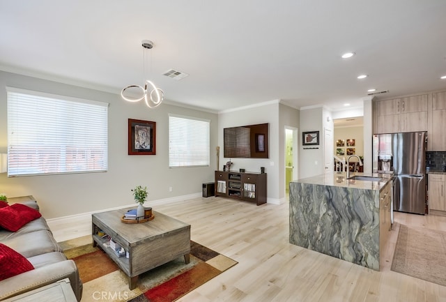 373 W Pebble Creek Ln, Orange, CA 92865 - living area featuring light wood-style flooring, recessed lighting, and ornamental molding