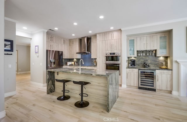 373 W Pebble Creek Ln, Orange, CA 92865 - kitchen with wine cooler, appliances with stainless steel finishes, wall chimney range hood, backsplash, and modern cabinets