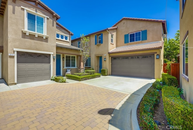 373 W Pebble Creek Ln, Orange, CA 92865 - view of front of house featuring concrete driveway, stucco siding, an attached garage, and a tile roof