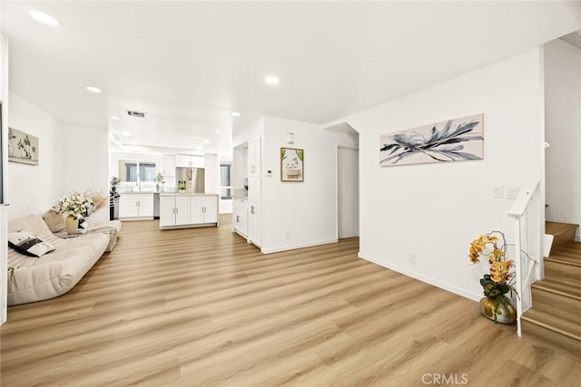 828 N Garfield Ave Unit C, Alhambra, CA 91801 - living room featuring light wood-style floors, recessed lighting, and stairway