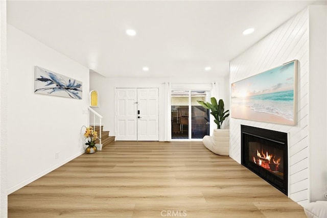 828 N Garfield Ave Unit C, Alhambra, CA 91801 - entrance foyer featuring a large fireplace, stairway, light wood-style flooring, and recessed lighting