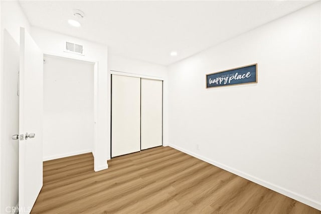 828 N Garfield Ave Unit C, Alhambra, CA 91801 - unfurnished bedroom featuring wood finished floors, recessed lighting, and a closet