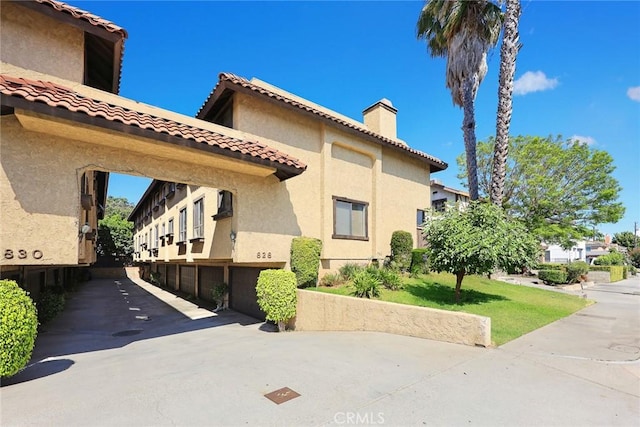 828 N Garfield Ave Unit C, Alhambra, CA 91801 - view of building exterior with a garage and driveway