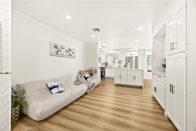 828 N Garfield Ave Unit C, Alhambra, CA 91801 - living room featuring recessed lighting and light wood-style floors