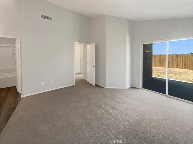 995 Northpark Blvd, San Bernardino, CA 92407 - unfurnished bedroom featuring carpet flooring, access to outside, and a high ceiling