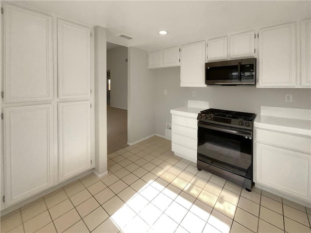995 Northpark Blvd, San Bernardino, CA 92407 - kitchen with stainless steel microwave, gas range oven, light countertops, white cabinets, and recessed lighting