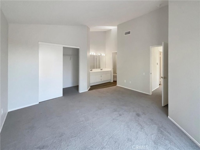 995 Northpark Blvd, San Bernardino, CA 92407 - unfurnished bedroom with carpet floors, ensuite bath, and a closet