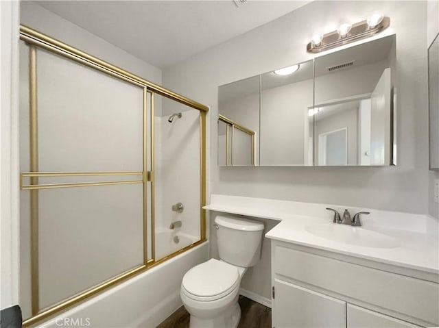 995 Northpark Blvd, San Bernardino, CA 92407 - bathroom with vanity, bath / shower combo with glass door, and wood finished floors