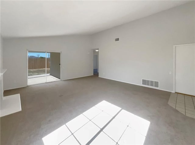 995 Northpark Blvd, San Bernardino, CA 92407 - unfurnished living room with carpet flooring and lofted ceiling