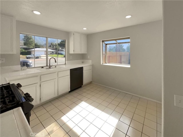 995 Northpark Blvd, San Bernardino, CA 92407 - kitchen featuring dishwasher, plenty of natural light, light countertops, and recessed lighting