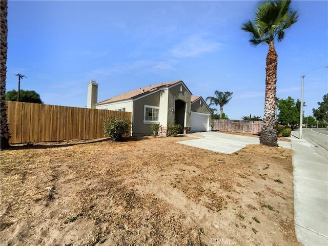 995 Northpark Blvd, San Bernardino, CA 92407 - view of front of property featuring stucco siding and a garage