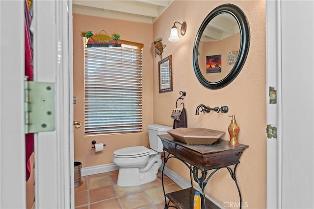 6720 Sycamore Ln, Palmdale, CA 93551 - bathroom featuring toilet and baseboards