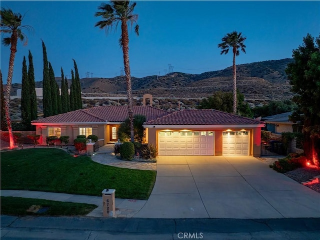 6720 Sycamore Ln, Palmdale, CA 93551 - single story home featuring a tiled roof, a mountain view, a front yard, an attached garage, and driveway