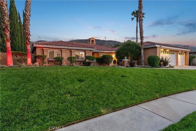 6720 Sycamore Ln, Palmdale, CA 93551 - view of front of property featuring stucco siding, a garage, a tile roof, a yard, and concrete driveway