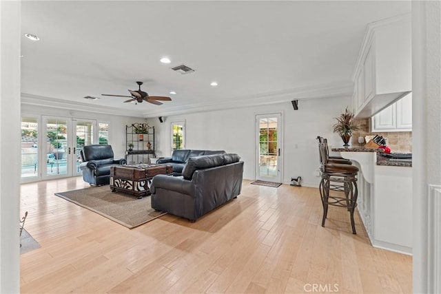 6720 Sycamore Ln, Palmdale, CA 93551 - living area with ceiling fan, healthy amount of natural light, light wood-type flooring, french doors, and ornamental molding
