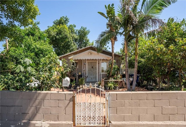215 E 11th St Unit 4, Pomona, CA 91766 - view of front facade with a fenced front yard and a gate
