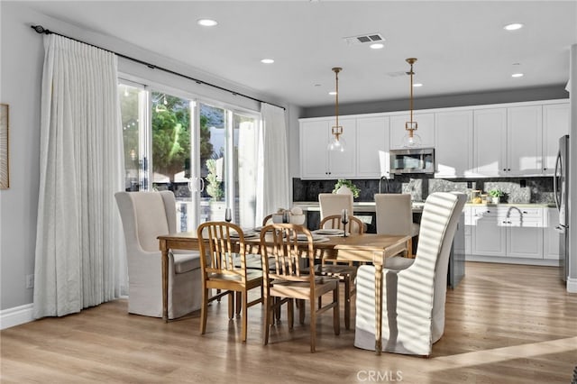 11824 Stonefield Dr, Corona, CA 92883 - dining room with light wood finished floors and recessed lighting