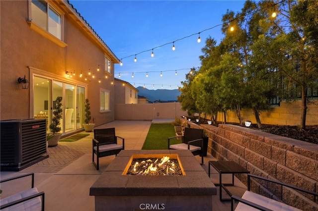 11824 Stonefield Dr, Corona, CA 92883 - fenced backyard featuring a patio area and an outdoor living space with a fire pit
