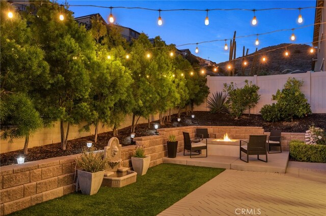 11824 Stonefield Dr, Corona, CA 92883 - fenced backyard featuring a fire pit and a patio