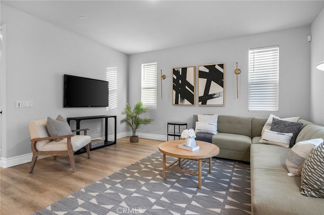 11824 Stonefield Dr, Corona, CA 92883 - living area featuring wood finished floors and baseboards