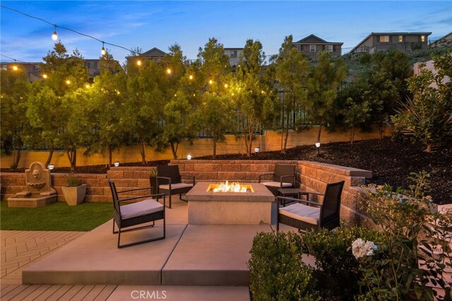 11824 Stonefield Dr, Corona, CA 92883 - view of patio / terrace featuring an outdoor fire pit
