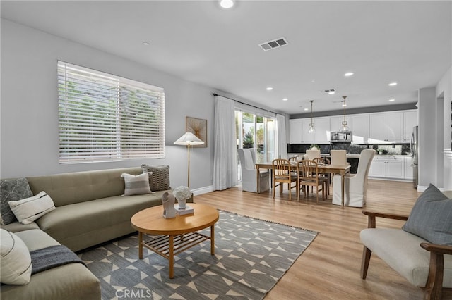 11824 Stonefield Dr, Corona, CA 92883 - living room with light wood-style flooring and recessed lighting